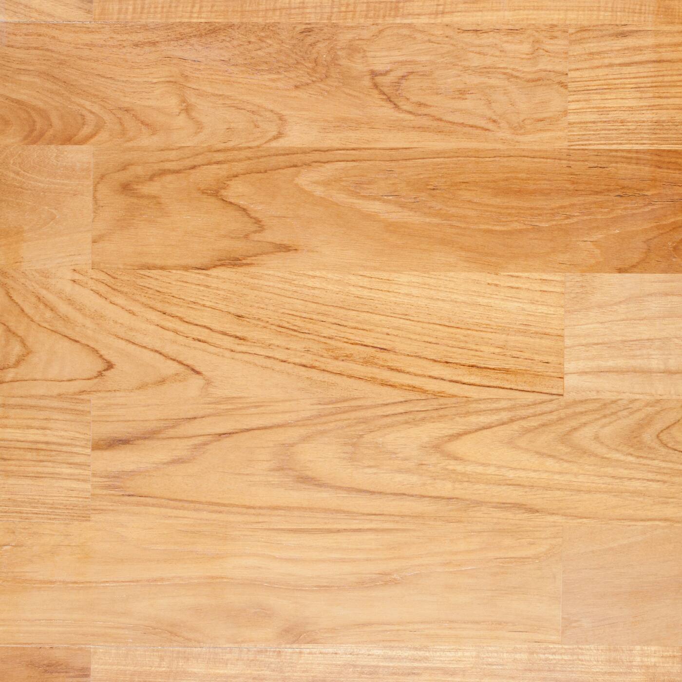 Close-up of the grain on a honey-toned wood floor